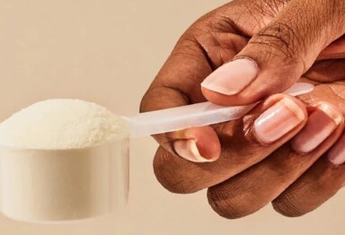 hand holding a scoop of collagen peptides powder