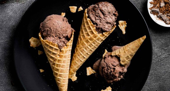 Three waffles cones filled with chocolate ice cream