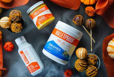 Keto pumpkin cake pops surrounded with Bulletproof Ingredients and pumpkins