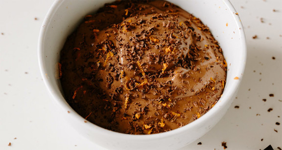 Chocolate collagen pudding in white bowl