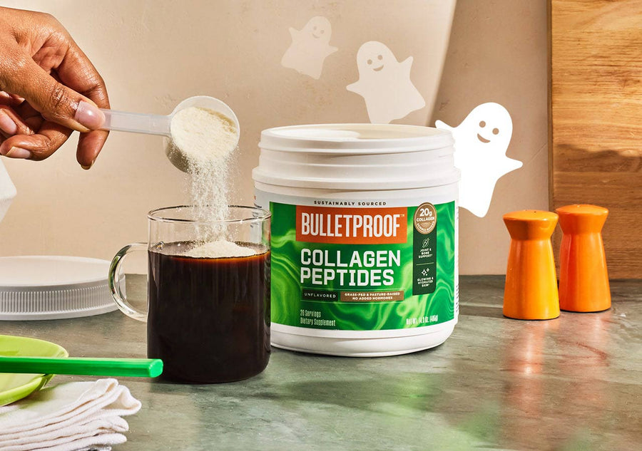 Bulletproof Collagen Peptides container beside a mug of coffee with a scoop of power being poured in. Fall theme with ghosts floating around the container.