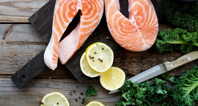 raw salmon, lemons, and kale