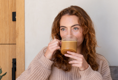 Young woman drinking Bulletproof Coffee.